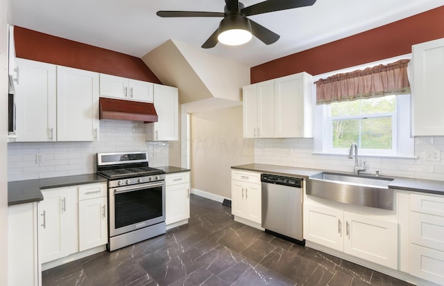 1350 Lancaster Kirkersville Rd NW, Lancaster, OH 43130 - kitchen with stainless steel appliances, custom range hood, a sink, dark countertops, and ceiling fan