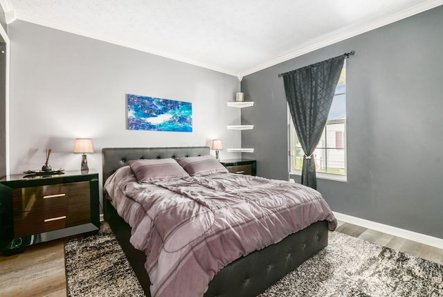 3097 Lee Ellen Pl, Columbus, OH 43207 - bedroom with light wood finished floors, ornamental molding, and baseboards