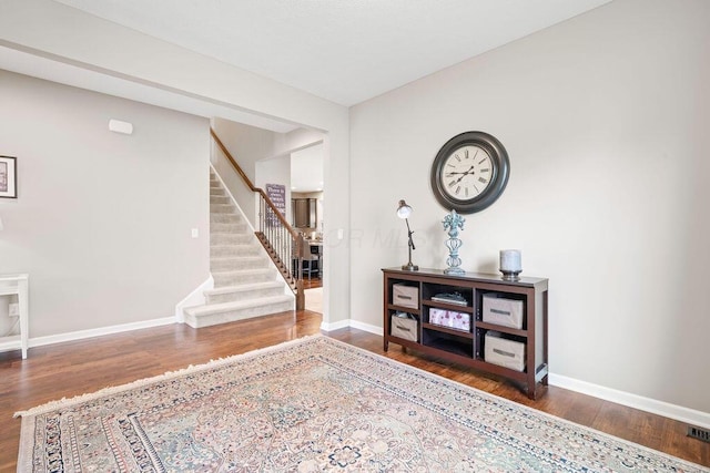 2045 E Gardenia Dr, Pataskala, OH 43062 - foyer entrance with wood finished floors, stairway, and baseboards
