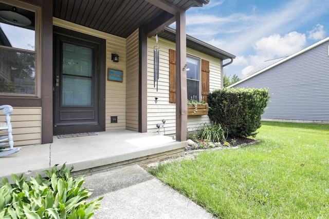 384 Sandburr Dr, Columbus, OH 43230 - view of exterior entry with covered porch and a yard