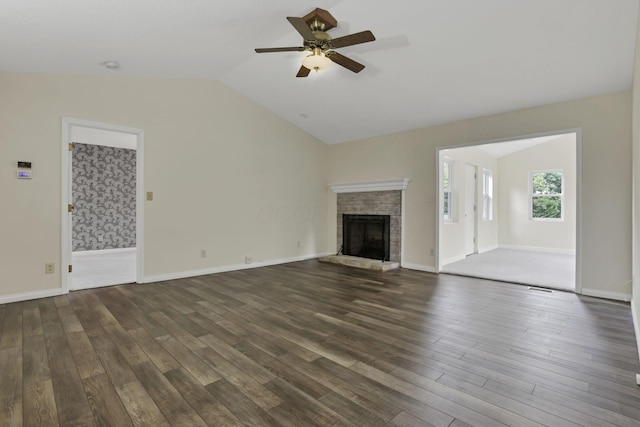 384 Sandburr Dr, Columbus, OH 43230 - unfurnished living room with lofted ceiling, a ceiling fan, dark wood-style flooring, and a fireplace