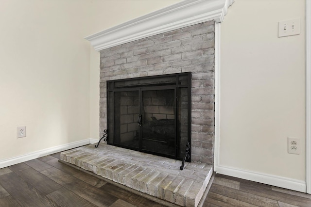 384 Sandburr Dr, Columbus, OH 43230 - detailed view of a brick fireplace and wood finished floors