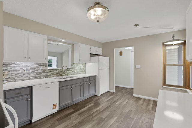 384 Sandburr Dr, Columbus, OH 43230 - kitchen featuring white appliances, gray cabinets, backsplash, and wood finished floors