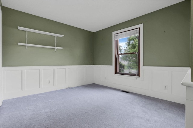 384 Sandburr Dr, Columbus, OH 43230 - carpeted spare room with wainscoting and a decorative wall