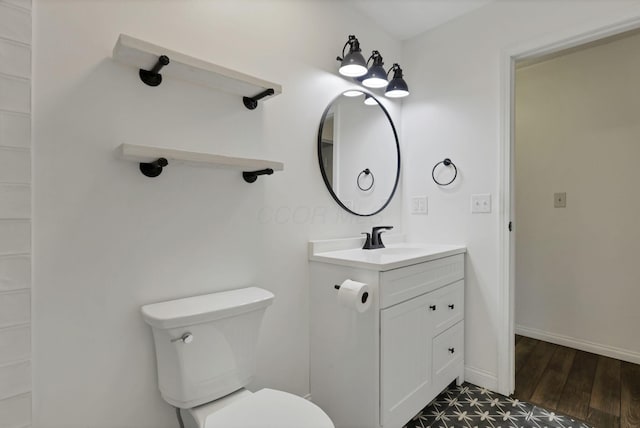 384 Sandburr Dr, Columbus, OH 43230 - bathroom featuring vanity and wood finished floors