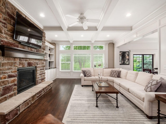 2462 Mccumber Ln, Lewis Center, OH 43035 - living room with dark wood-type flooring, plenty of natural light, ornamental molding, beamed ceiling, and ceiling fan