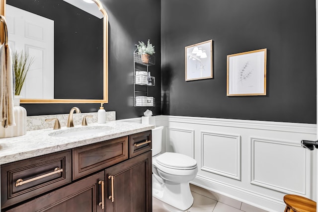 9568 Craigens Ct, Galena, OH 43021 - bathroom with vanity, tile patterned floors, a decorative wall, wainscoting, and toilet