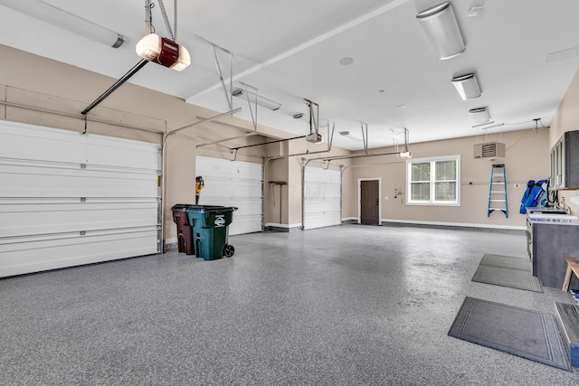 9568 Craigens Ct, Galena, OH 43021 - garage featuring a garage door opener and baseboards