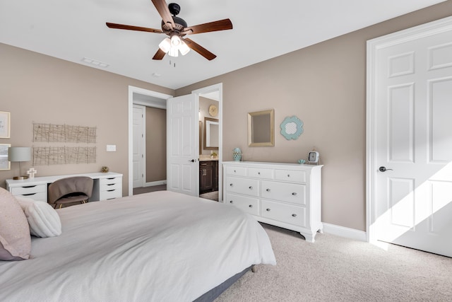 9568 Craigens Ct, Galena, OH 43021 - bedroom with light carpet, baseboards, ensuite bathroom, and ceiling fan