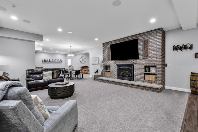 9568 Craigens Ct, Galena, OH 43021 - carpeted living room with recessed lighting, a brick fireplace, and baseboards