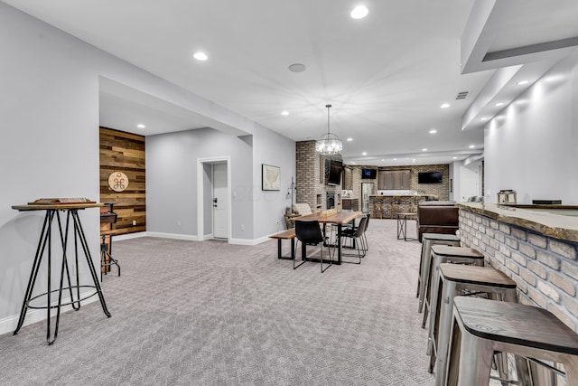 9568 Craigens Ct, Galena, OH 43021 - dining room with recessed lighting, light colored carpet, baseboards, wooden walls, and an accent wall