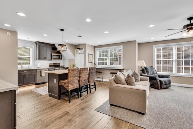 9568 Craigens Ct, Galena, OH 43021 - living area with a ceiling fan, baseboards, healthy amount of natural light, recessed lighting, and light wood-type flooring