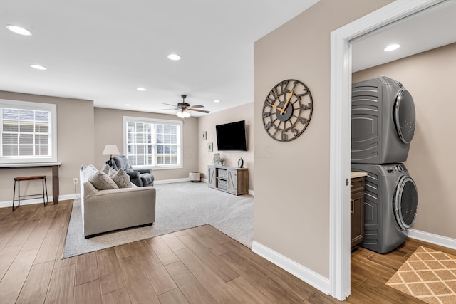 9568 Craigens Ct, Galena, OH 43021 - living area featuring stacked washer and clothes dryer, baseboards, wood finished floors, ceiling fan, and recessed lighting