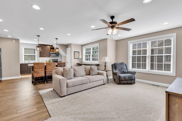 9568 Craigens Ct, Galena, OH 43021 - living area featuring baseboards, recessed lighting, a ceiling fan, and light wood-style floors