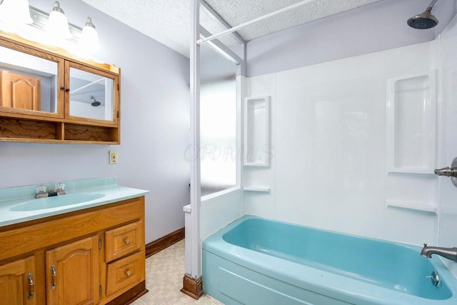 1936 Case Rd, Columbus, OH 43224 - bathroom with vanity, shower / bathtub combination, tile patterned floors, baseboards, and a textured ceiling
