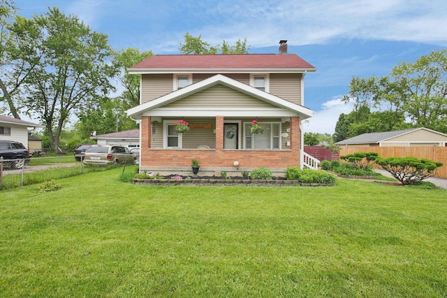 1936 Case Rd, Columbus, OH 43224 - view of front of house featuring a chimney, brick siding, and covered porch