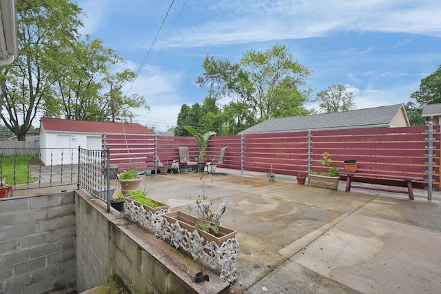 1936 Case Rd, Columbus, OH 43224 - fenced backyard featuring a patio area and an outbuilding