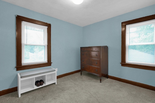 1936 Case Rd, Columbus, OH 43224 - carpeted bedroom featuring multiple windows and baseboards
