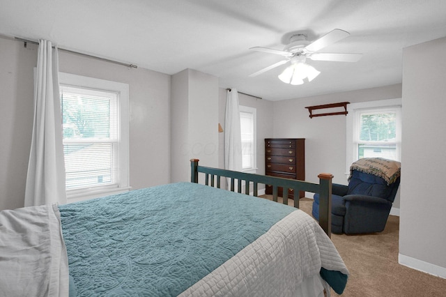 1936 Case Rd, Columbus, OH 43224 - bedroom with carpet flooring, multiple windows, a ceiling fan, and baseboards