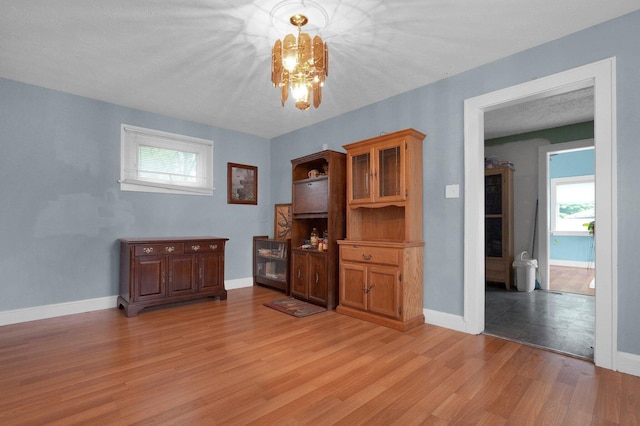 1936 Case Rd, Columbus, OH 43224 - dining room featuring a chandelier, light wood-style flooring, and baseboards