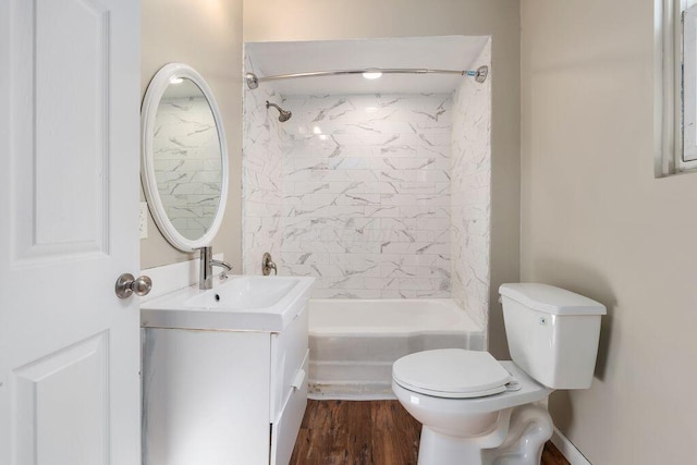 2165 Amherst Ave, Columbus, OH 43223 - bathroom featuring vanity, toilet, shower / washtub combination, and wood finished floors