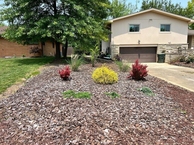 2740 Sonata Dr, Columbus, OH 43209 - view of front of home with brick siding, a garage, and concrete driveway