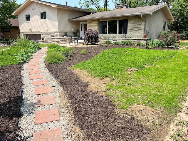 2740 Sonata Dr, Columbus, OH 43209 - view of front of property with a chimney, stone siding, a garage, and a front yard