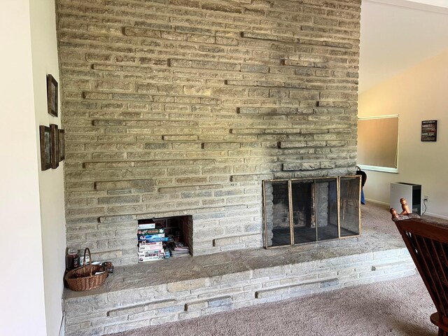 2740 Sonata Dr, Columbus, OH 43209 - unfurnished living room with a brick fireplace, carpet floors, and baseboards