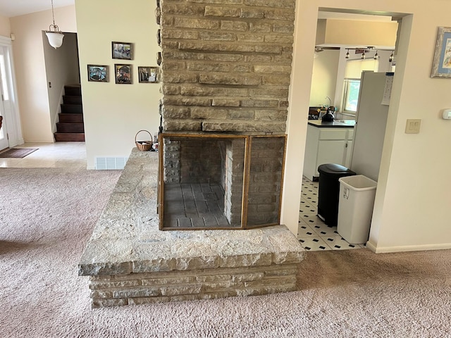 2740 Sonata Dr, Columbus, OH 43209 - detailed view of carpet floors, a brick fireplace, and baseboards