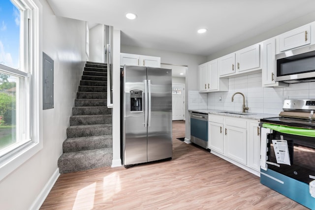 1805 Meriline Ave, Obetz, OH 43207 - kitchen featuring appliances with stainless steel finishes, a sink, light stone counters, white cabinets, and recessed lighting