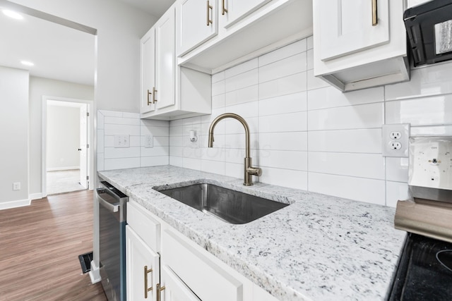 1805 Meriline Ave, Obetz, OH 43207 - kitchen with a sink, tasteful backsplash, white cabinets, wood finished floors, and baseboards