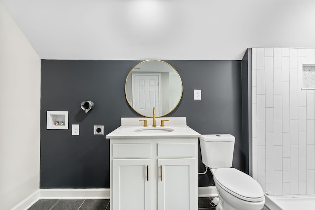 1805 Meriline Ave, Obetz, OH 43207 - full bath with toilet, baseboards, vanity, a tile shower, and tile patterned floors