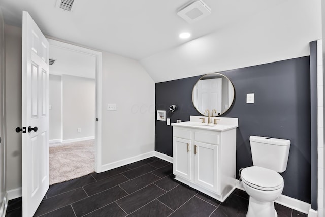 1805 Meriline Ave, Obetz, OH 43207 - bathroom featuring vanity, baseboards, vaulted ceiling, toilet, and tile patterned flooring
