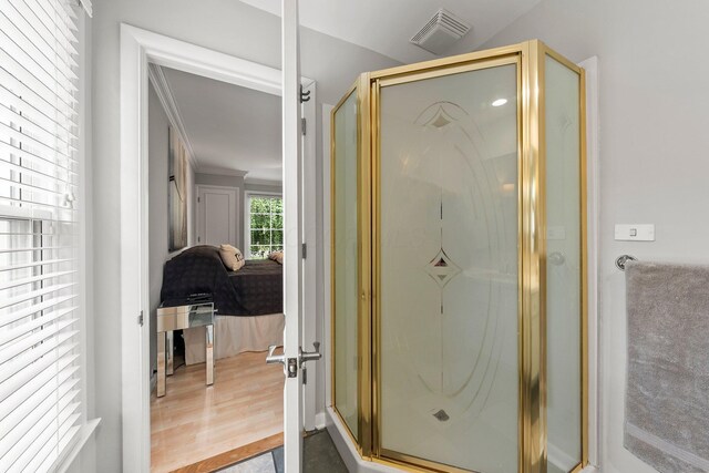 195 S Gould Rd, Columbus, OH 43209 - full bathroom with a shower stall, ensuite bathroom, ornamental molding, and wood finished floors