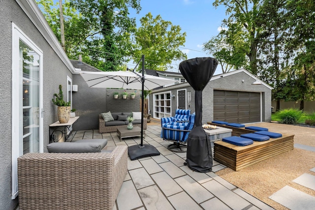 195 S Gould Rd, Columbus, OH 43209 - view of patio / terrace featuring an outdoor living space with a fire pit, a garage, and an outdoor structure