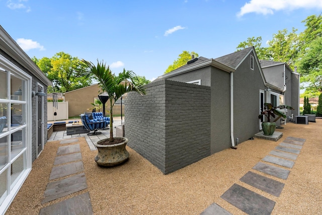 195 S Gould Rd, Columbus, OH 43209 - view of side of property with a patio area, stucco siding, and an outdoor hangout area