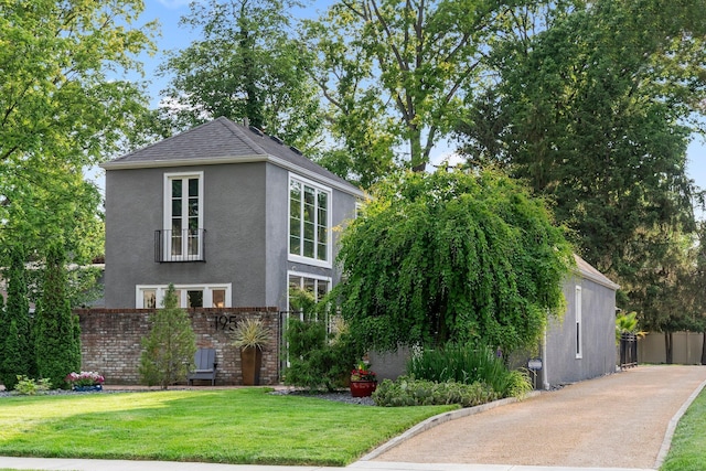195 S Gould Rd, Columbus, OH 43209 - view of front of property with stucco siding, brick siding, and roof with shingles