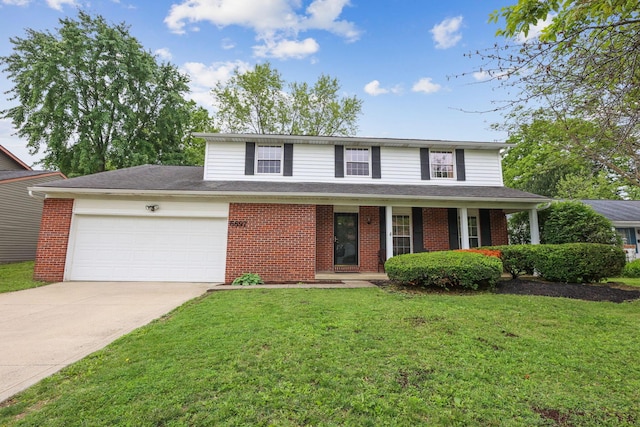 6897 Roundelay Rd N, Reynoldsburg, OH 43068 - traditional-style house with an attached garage, brick siding, and concrete driveway