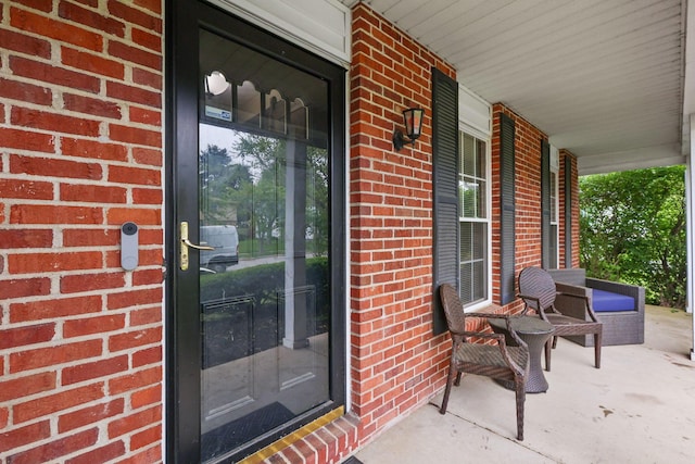 6897 Roundelay Rd N, Reynoldsburg, OH 43068 - entrance to property featuring a porch and brick siding