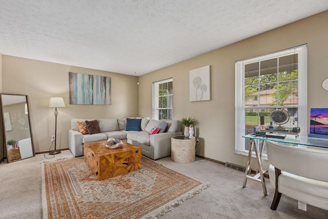 6897 Roundelay Rd N, Reynoldsburg, OH 43068 - carpeted living area with baseboards and a textured ceiling