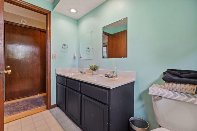 6897 Roundelay Rd N, Reynoldsburg, OH 43068 - bathroom with double vanity and toilet