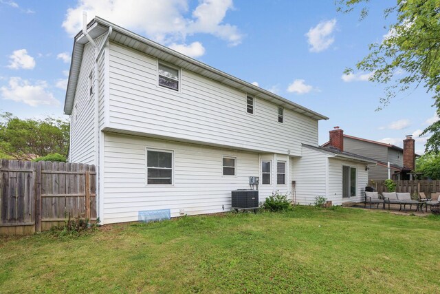 6897 Roundelay Rd N, Reynoldsburg, OH 43068 - rear view of property with central air condition unit, outdoor lounge area, and a patio