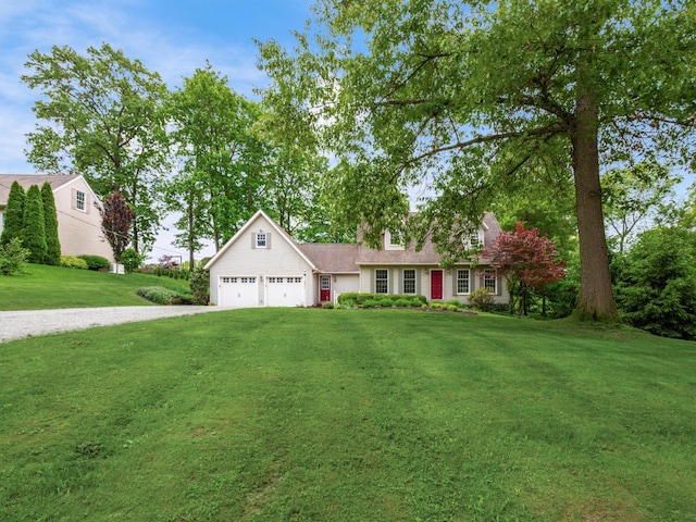 2870 Tarkman Dr, Nashport, OH 43830 - view of front of house featuring a garage, gravel driveway, and a front lawn