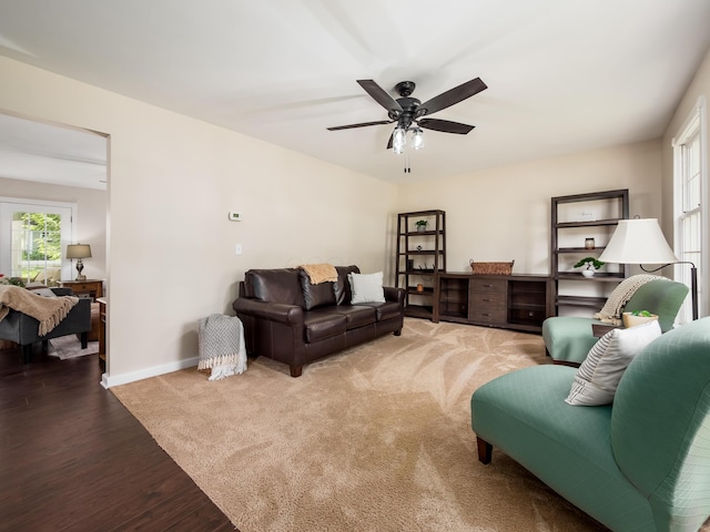 2870 Tarkman Dr, Nashport, OH 43830 - living area featuring healthy amount of natural light, wood finished floors, ceiling fan, and baseboards