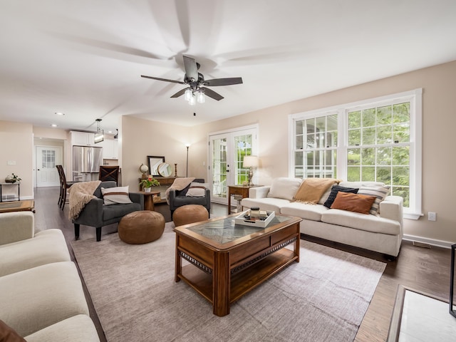 2870 Tarkman Dr, Nashport, OH 43830 - living area with a ceiling fan, wood finished floors, french doors, baseboards, and recessed lighting