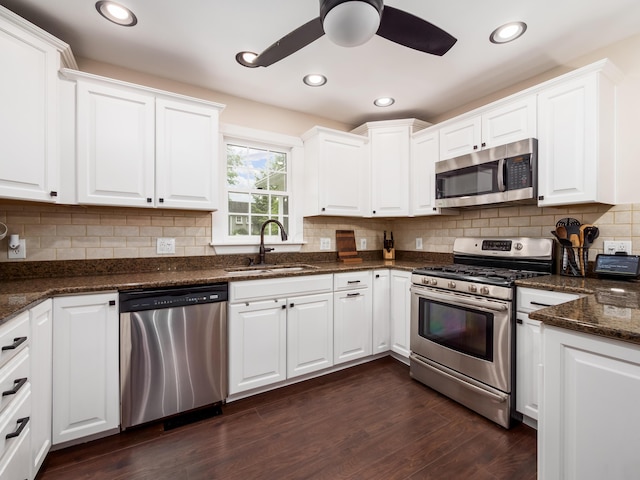 2870 Tarkman Dr, Nashport, OH 43830 - kitchen with appliances with stainless steel finishes, a sink, white cabinetry, a ceiling fan, and dark wood finished floors