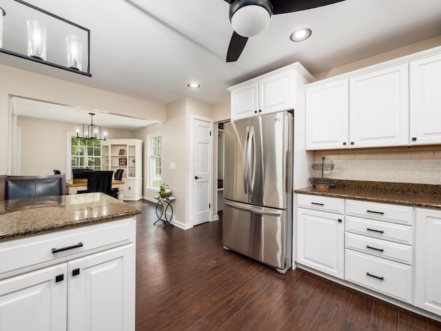 2870 Tarkman Dr, Nashport, OH 43830 - kitchen featuring freestanding refrigerator, dark wood-style floors, backsplash, recessed lighting, and dark stone countertops