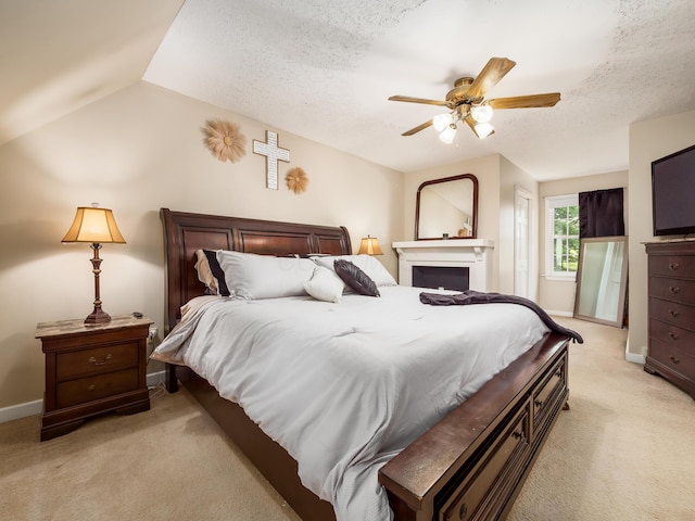 2870 Tarkman Dr, Nashport, OH 43830 - bedroom with light carpet, baseboards, a textured ceiling, a ceiling fan, and vaulted ceiling