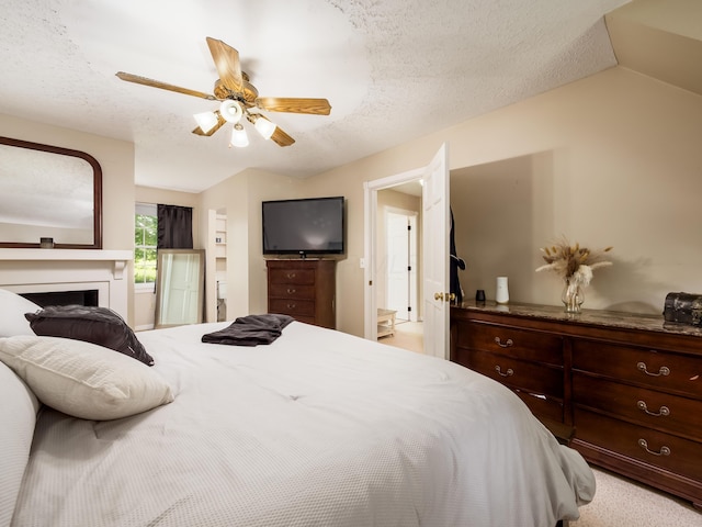 2870 Tarkman Dr, Nashport, OH 43830 - bedroom with a ceiling fan, a textured ceiling, vaulted ceiling, and light colored carpet