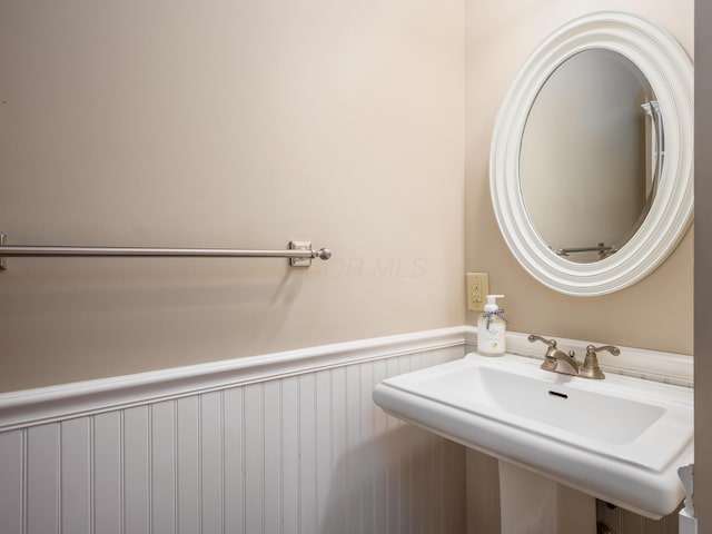 2870 Tarkman Dr, Nashport, OH 43830 - bathroom featuring wainscoting and a sink